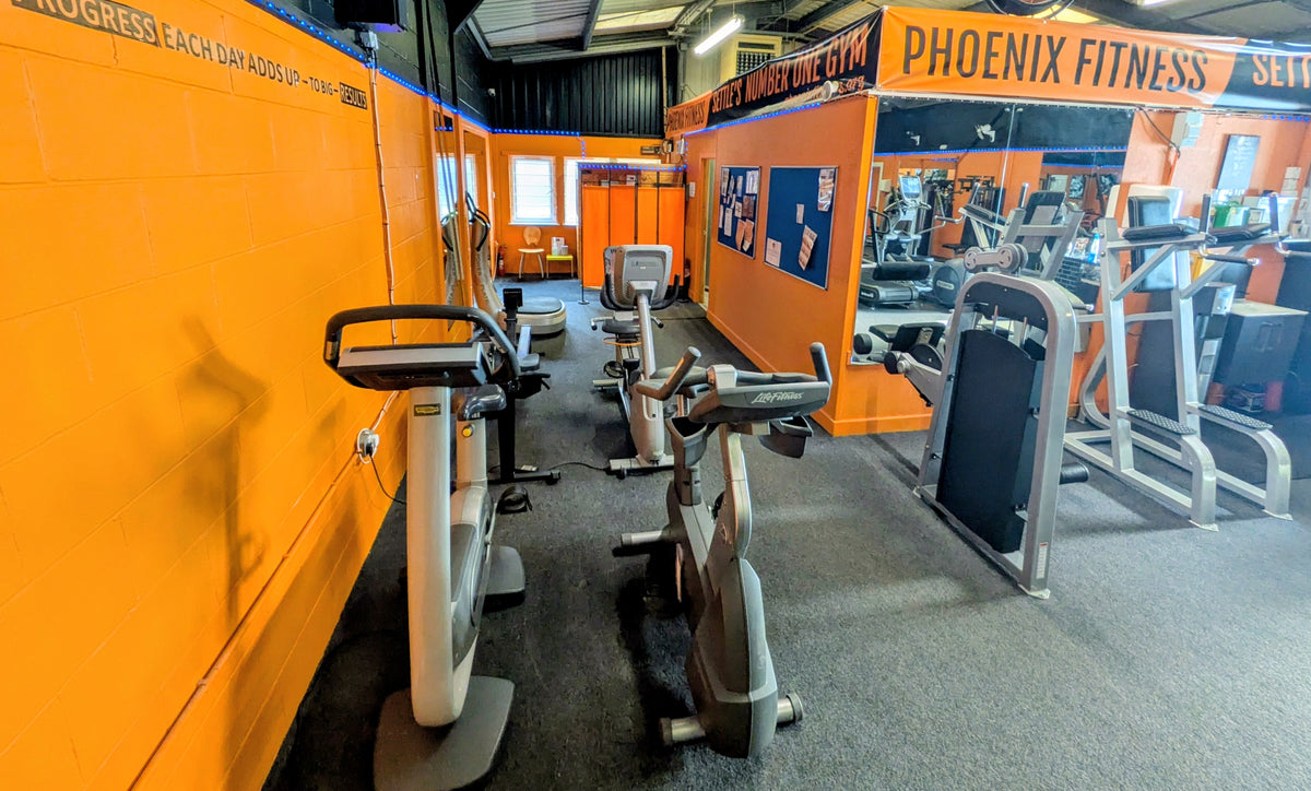 Cardio machines along the wall at Phoenix Fitness Settle